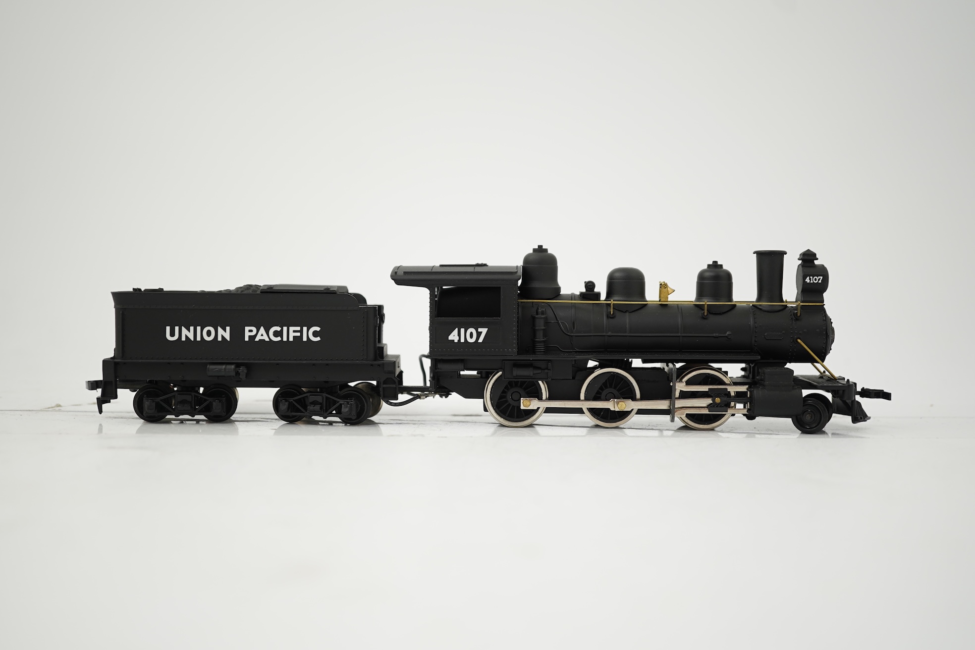 Two boxed HO gauge Union Pacific locomotives; a Genesis (G9008) model of USRA, 2495, 2-8-2 locomotive with bogie tender, together with a Mantua (313-003) 2-6-0 Mogul locomotive with bogie tender, both powered for two rai